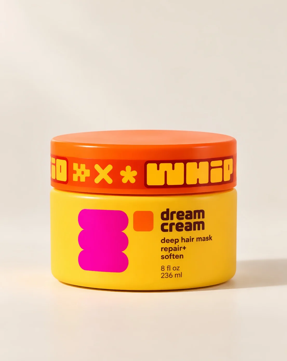 dream cream, a yellow jar with an orange lid and a pink stack
