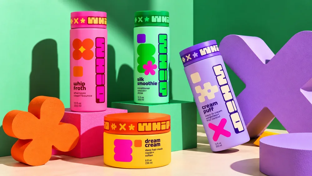 whipdreamz haircare: the whole line, whip froth, silk smoothie, dream cream and cream puff, on pink and green blocks
